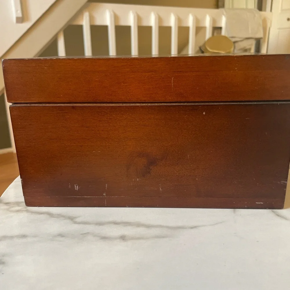 Wooden box for displaying coins with the name marked Danze logo